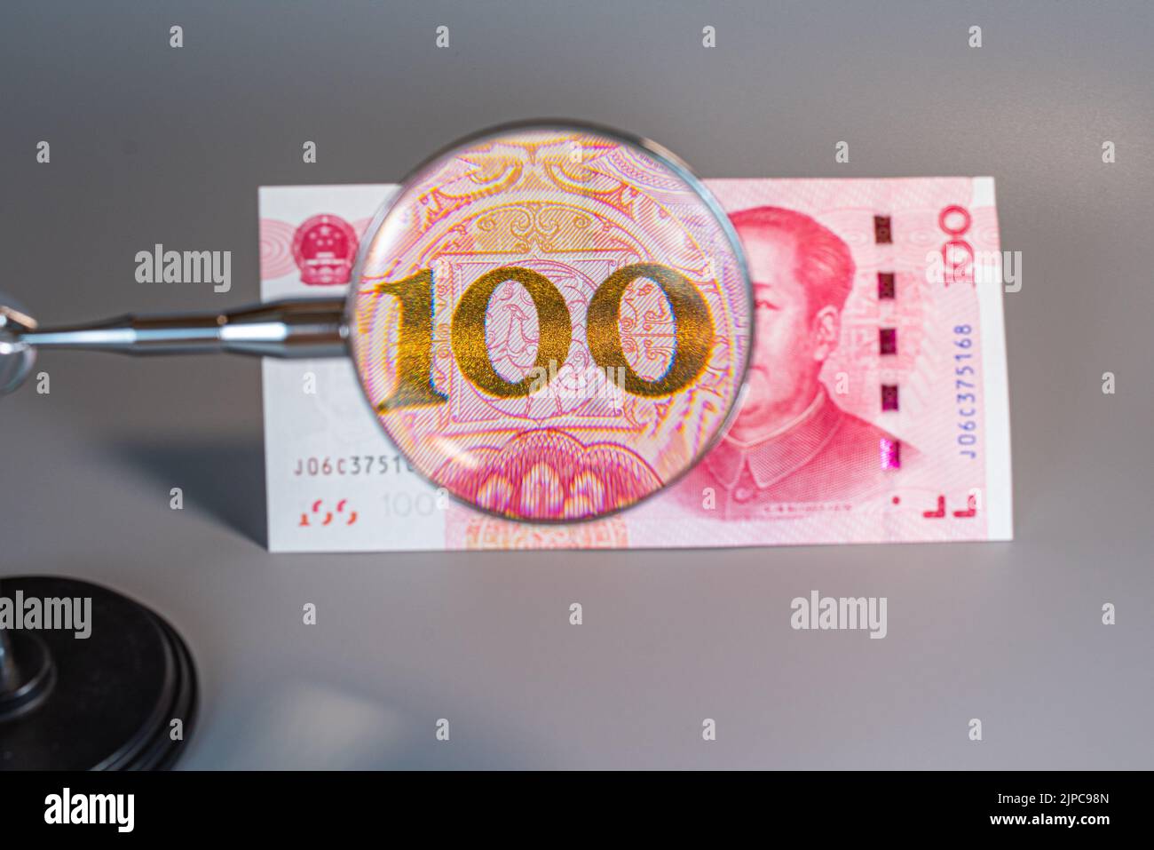 Closeup of chinese currency: Renminbi (RMB).The People`s Bank of China 100 yuan currency, economy, RMB, finance, investment, interest rate Stock Photo